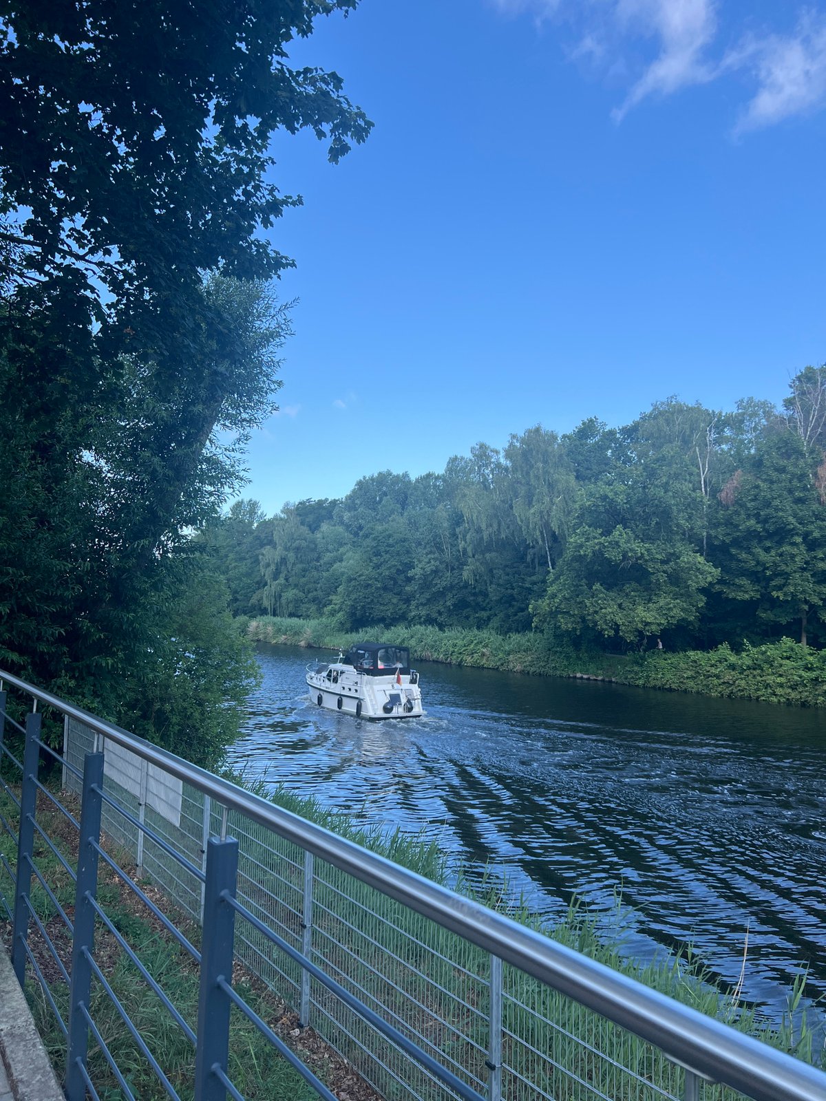 Morning on the Teltow canal: yacht cruising, workout wrapping up