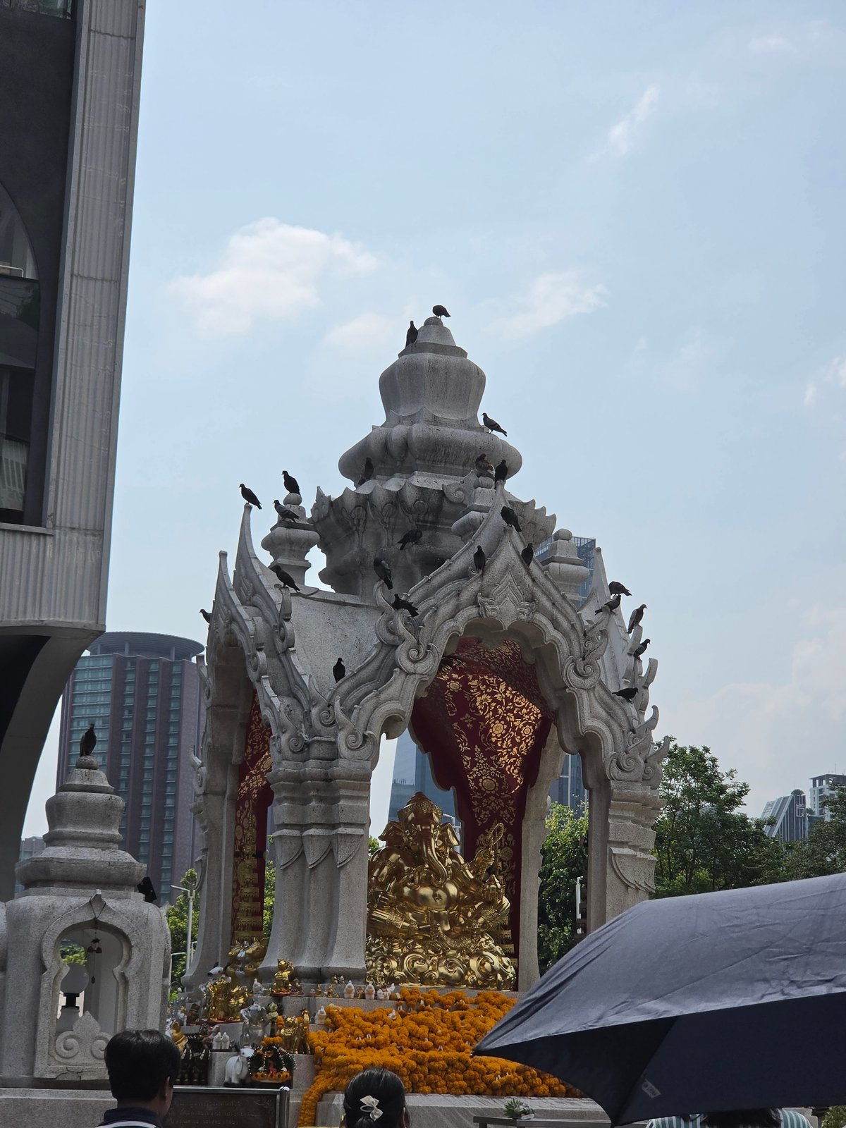 Morning activity documented at Bangkok's Erawan Shrine and vicinity