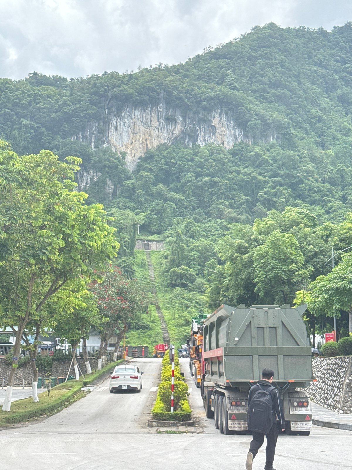 Semi-trucks parked near mountainous road in Đồng Đăng, Vietnam