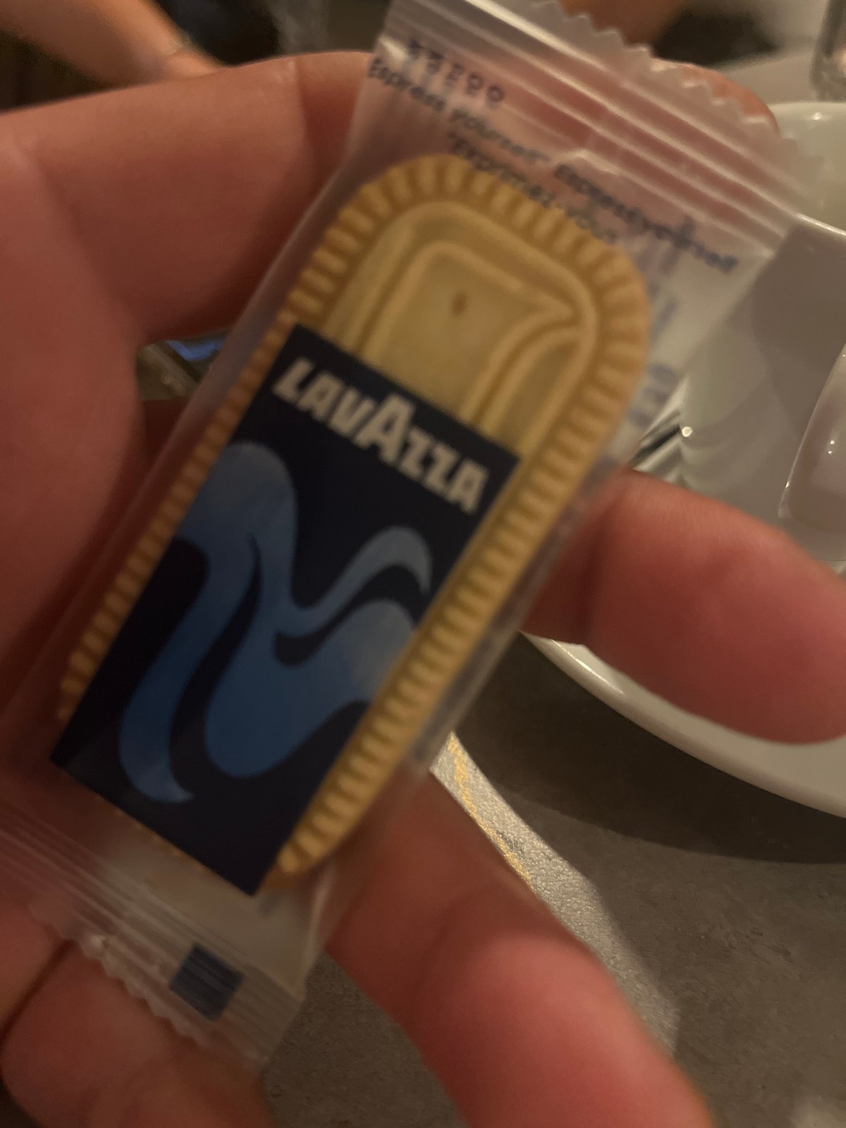 Lavazza branded cookie and Bulgarian promo pamphlet at a tasting