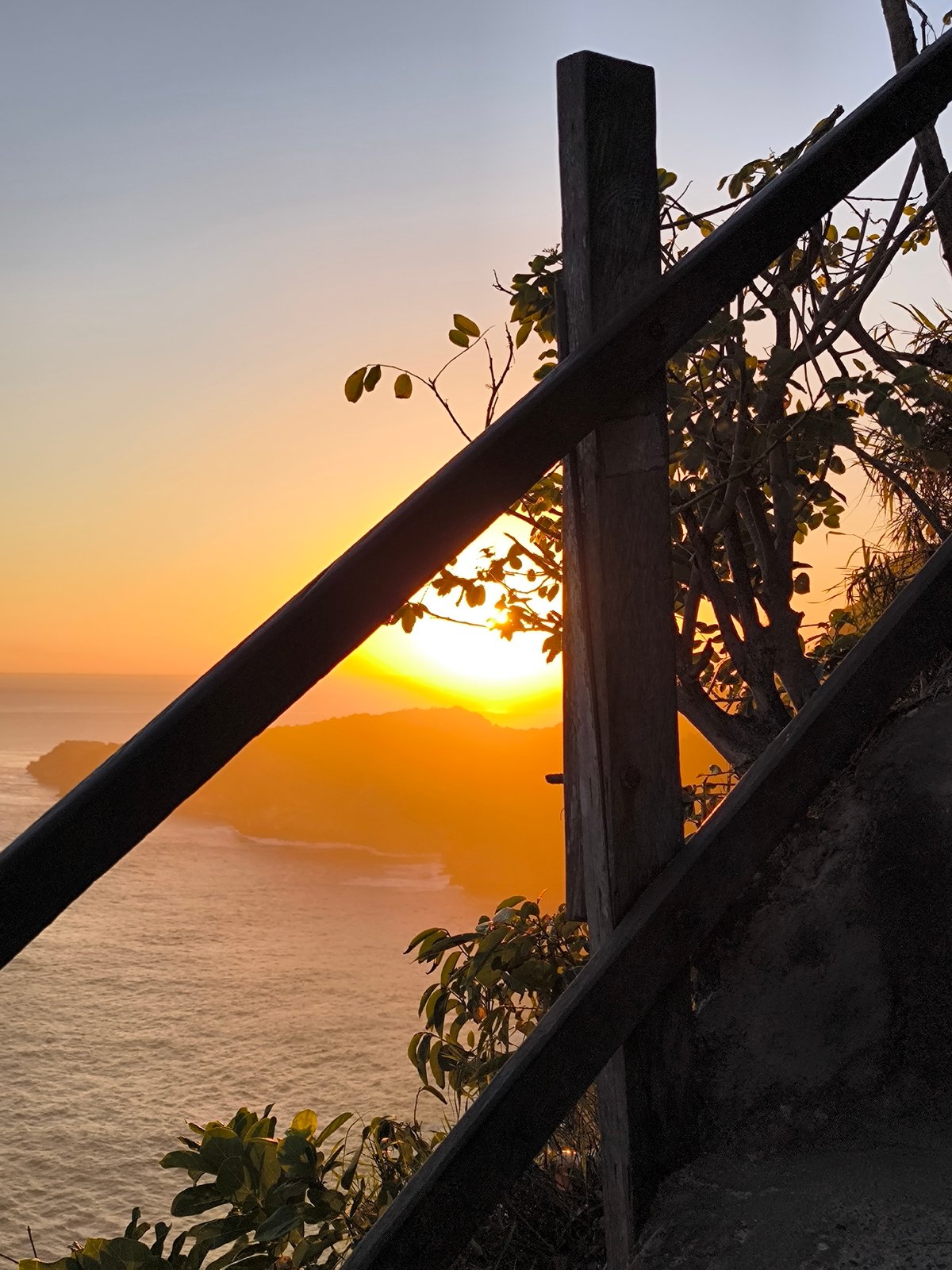 Sunset observed from wooden viewpoint near Nusa Penida, Indonesia