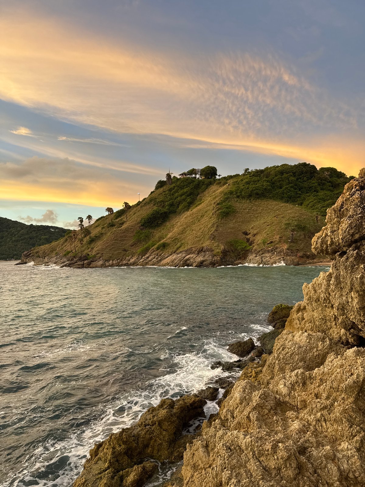 Rawai Beach: rocky shores, sunset skies, and casual beach life