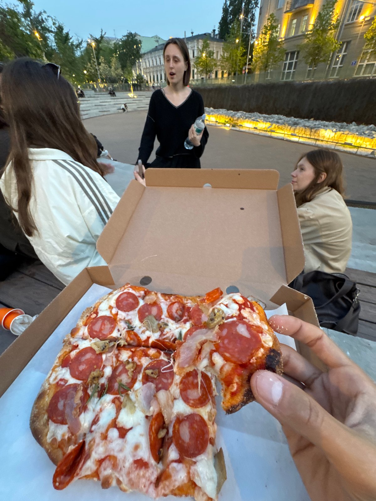 Group shares pizza at Moscow's Zaryadye Park