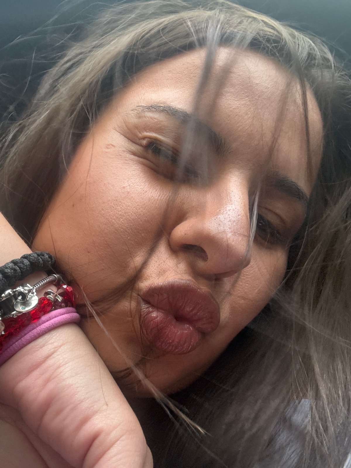 Woman takes kissing selfie in Velingrad, Bulgaria