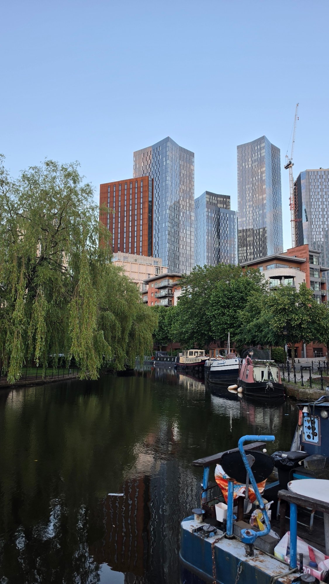 Manchester's Deansgate towers from the canal side