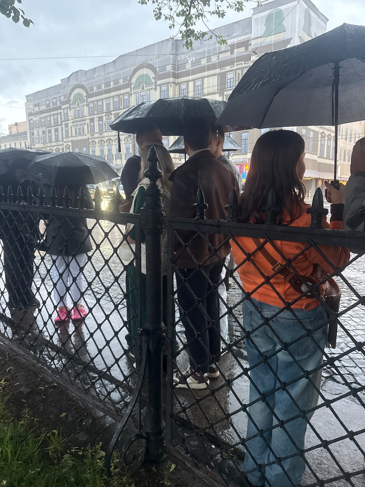 Rainy evening in Saint Petersburg: fire performers, wet streets, city life