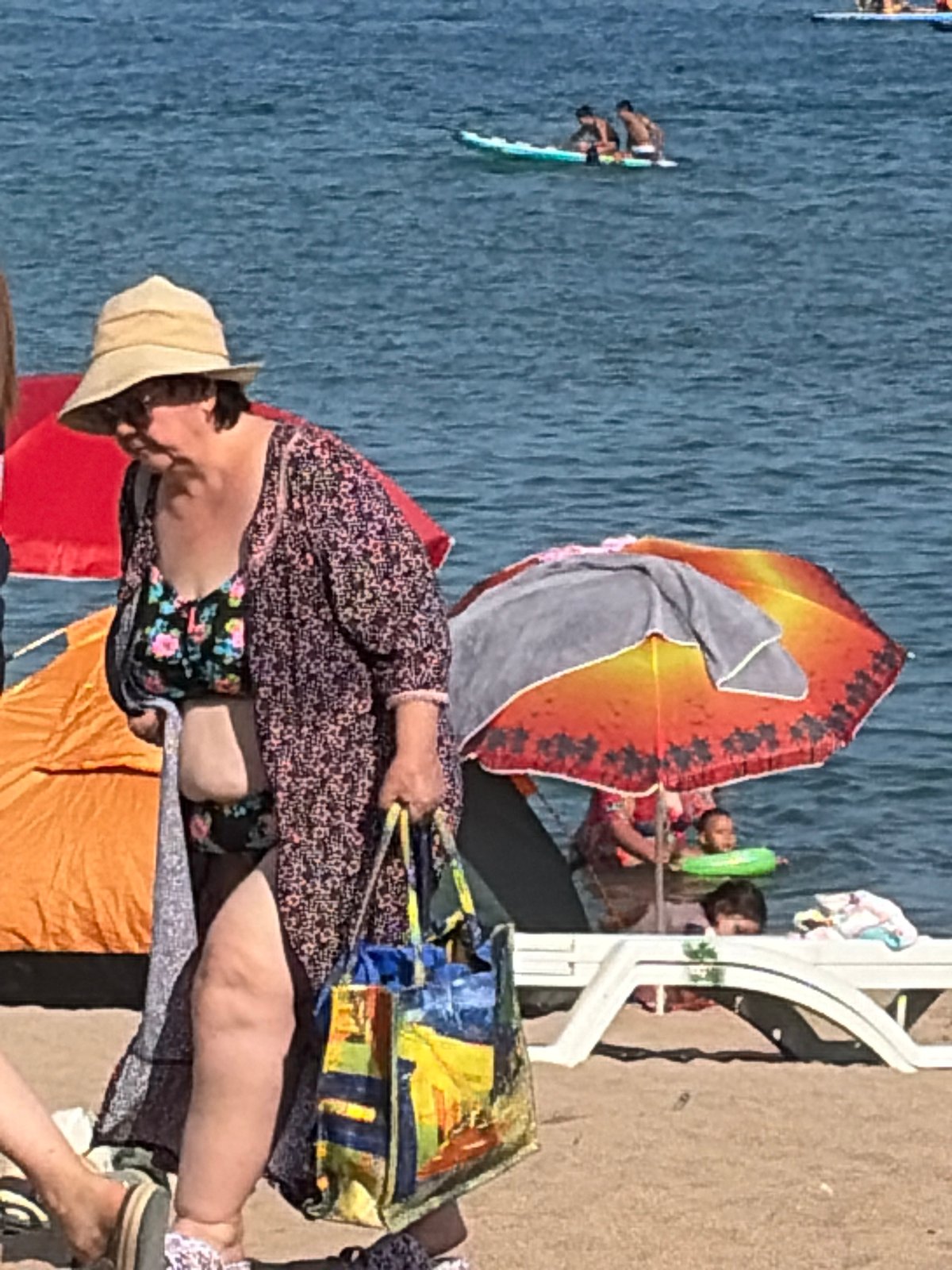 Beach day: water sports, shoreside hangouts, and a mystery pod offshore