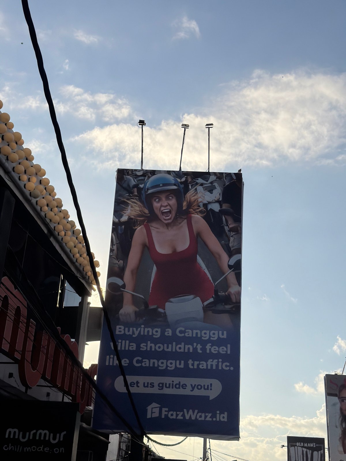 FazWaz.id motorcycle billboard photographed in North Kuta, Indonesia