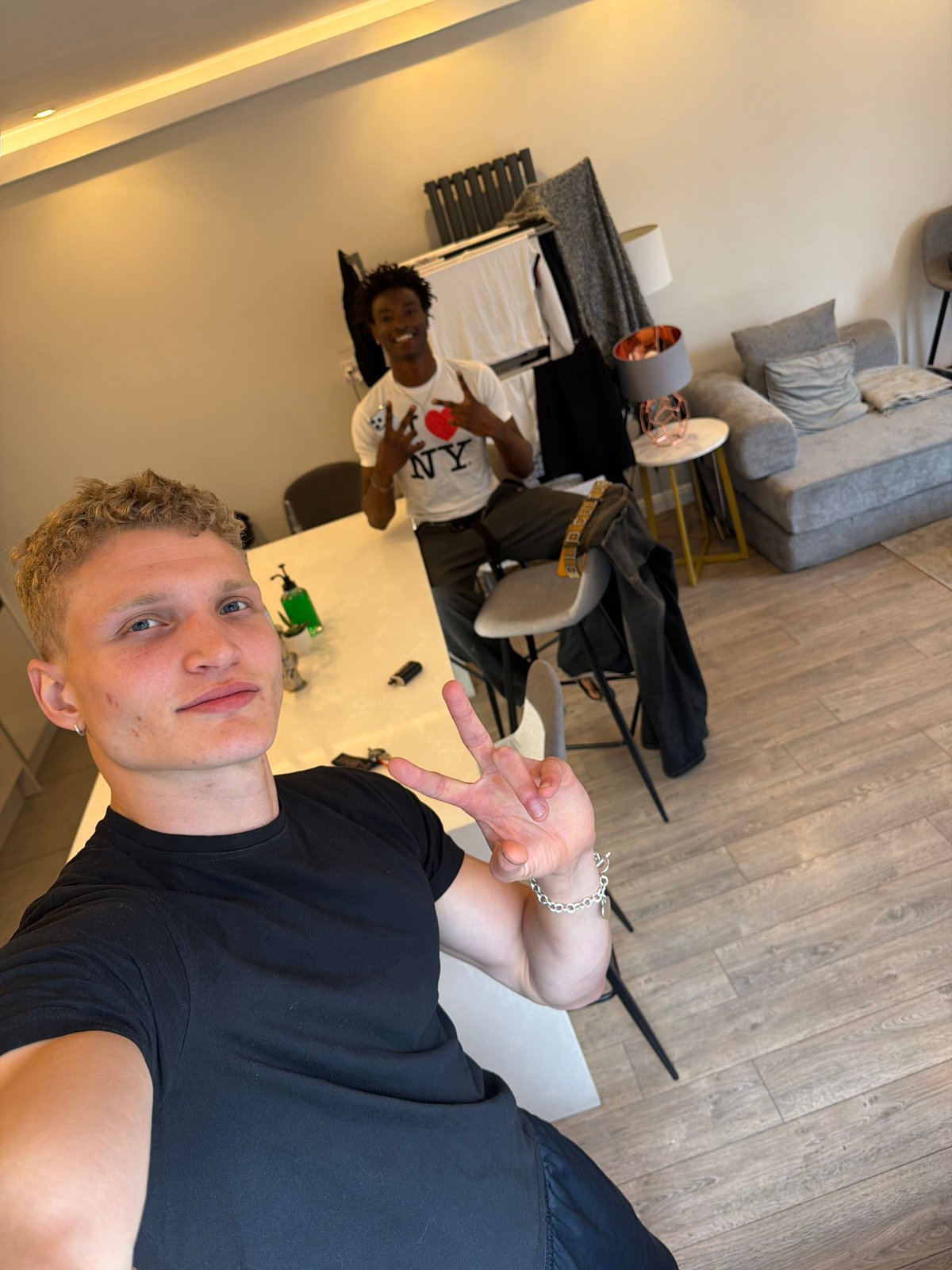 London flatmates share casual moments during rainy afternoon