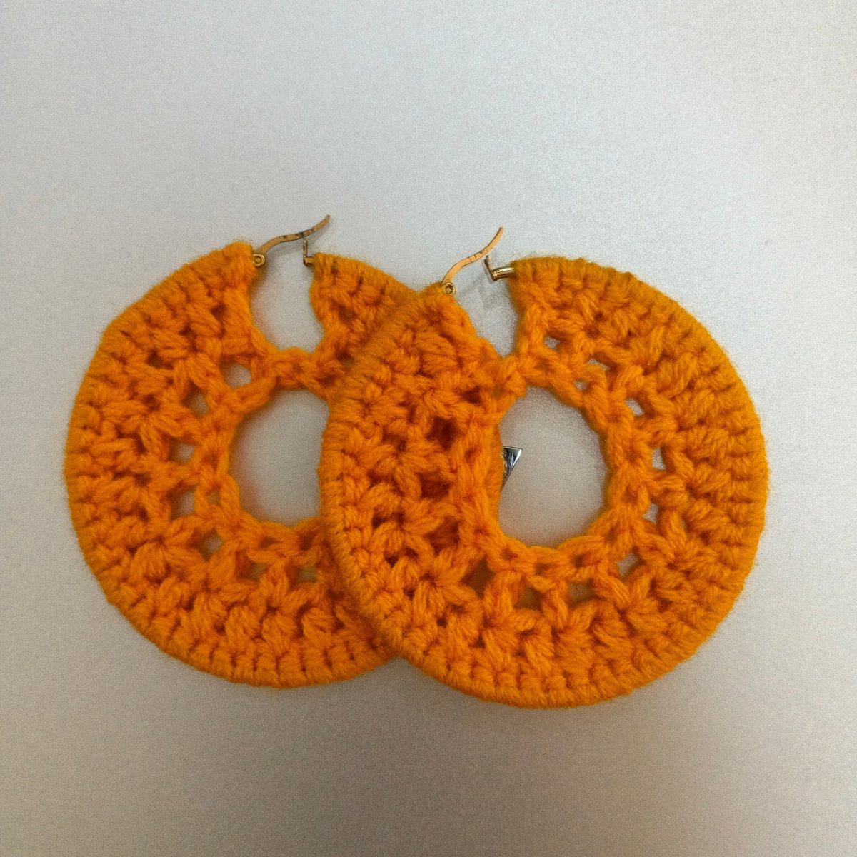 Handmade earrings and bold text graphics from Shaba
