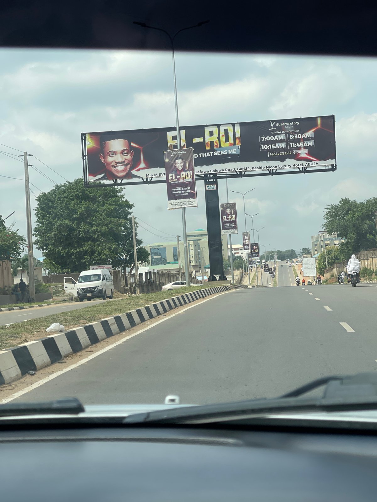 Traveler documents everyday Abuja scenes: billboards, buildings, construction