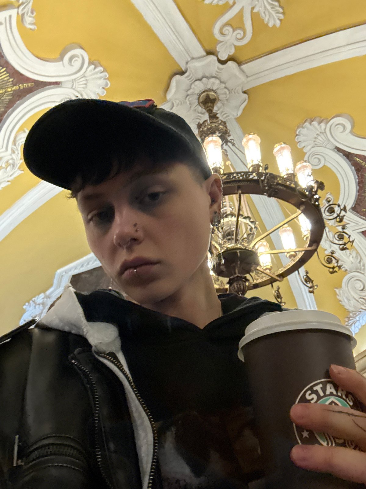 Coffee drinker spotted in ornate Moscow Metro station