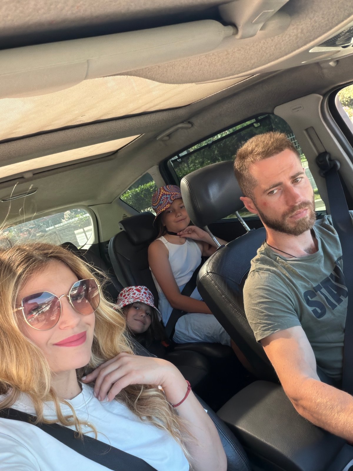 Family travels through Budva Montenegro during early morning hours
