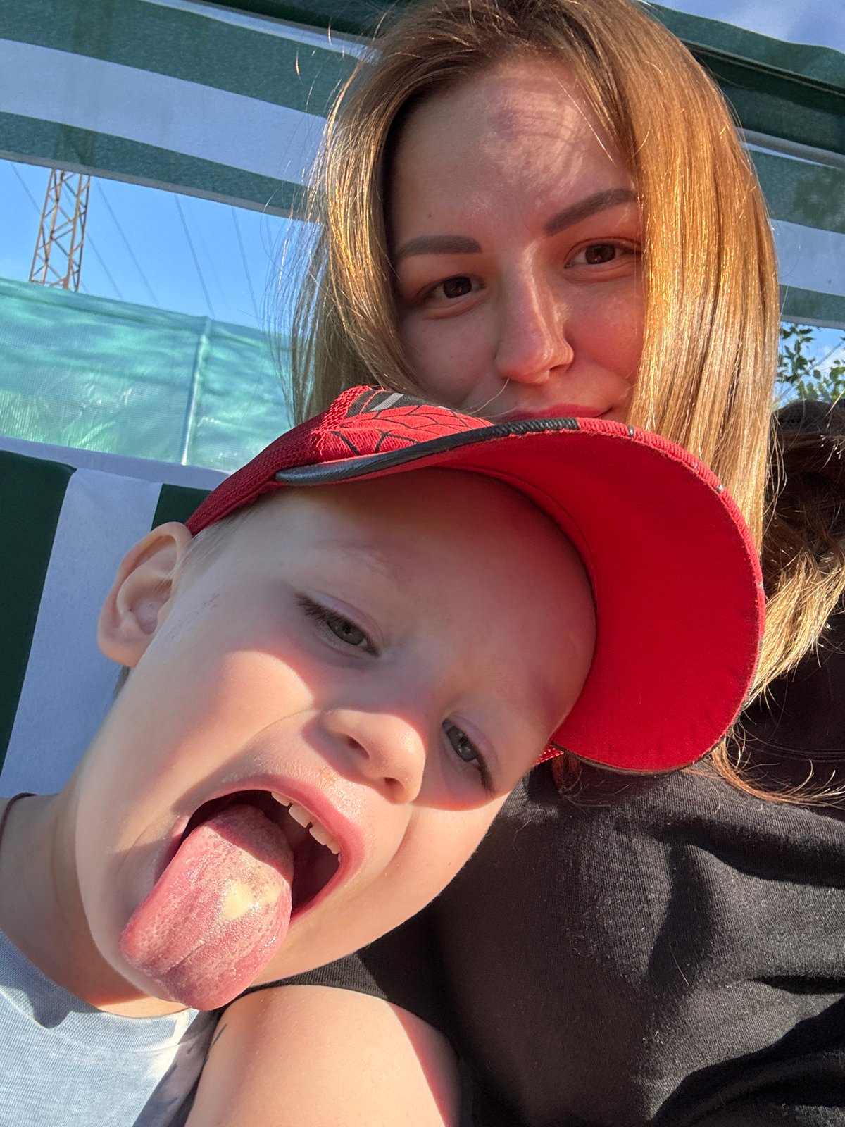 Mother, child enjoy sunny afternoon in Chaikovsky gardens