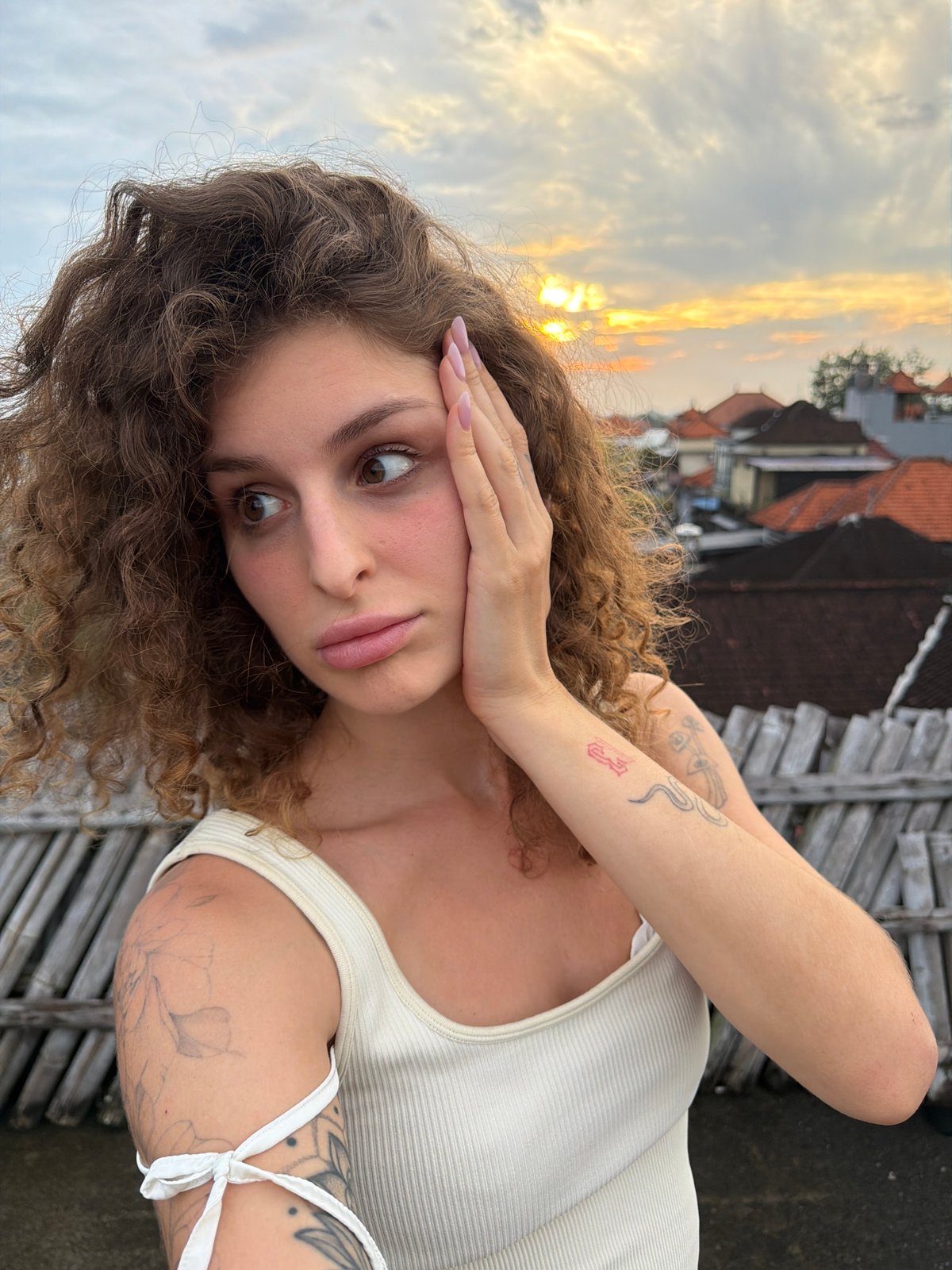 Tourist documents misty North Kuta sunrise with selfies and landscapes