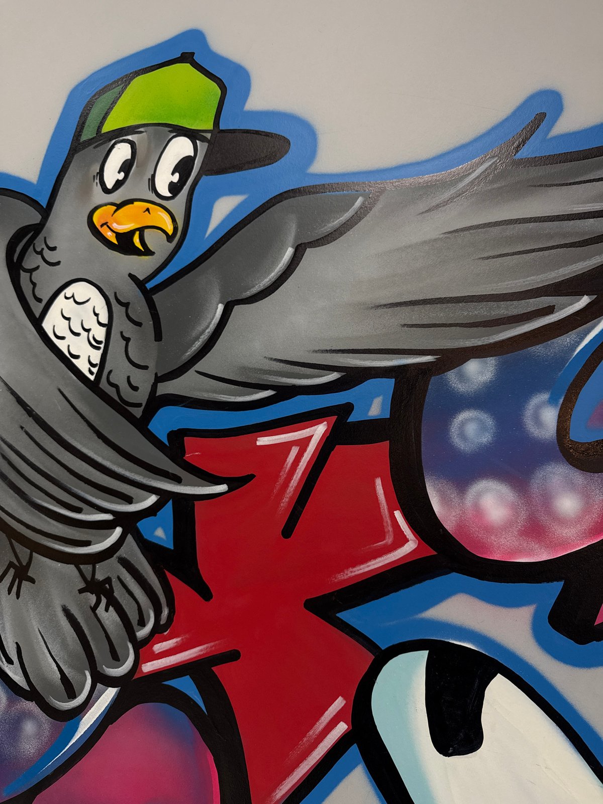 Vibrant bird graffiti mural documented in Vladivostok, Russia