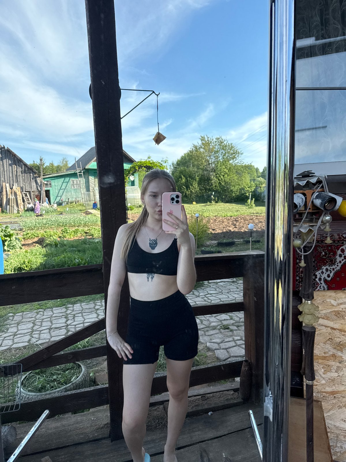 Woman takes selfies with dog in rural Russia
