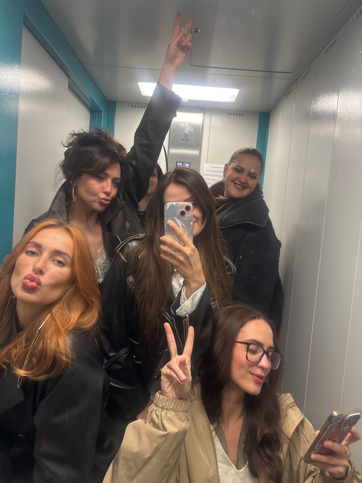 Six women spotted in elevator at unknown location