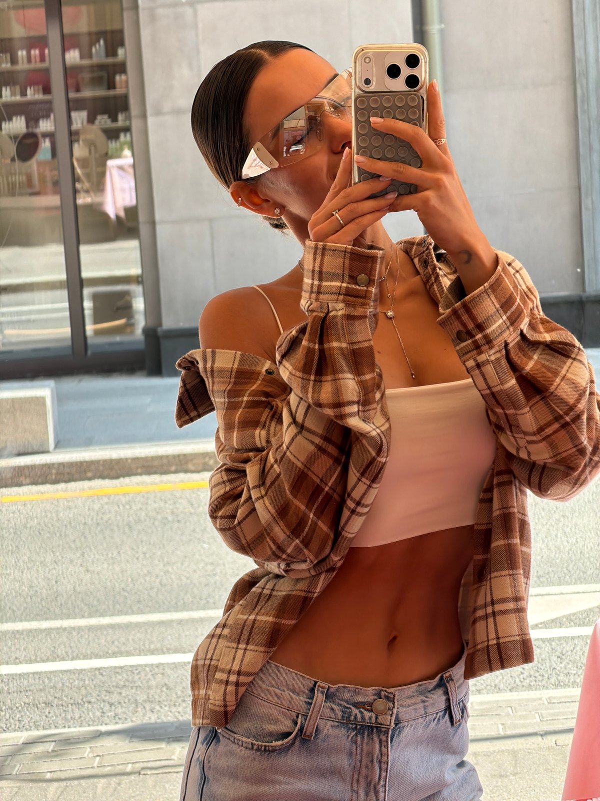 Woman takes mirror selfies in Moscow morning session