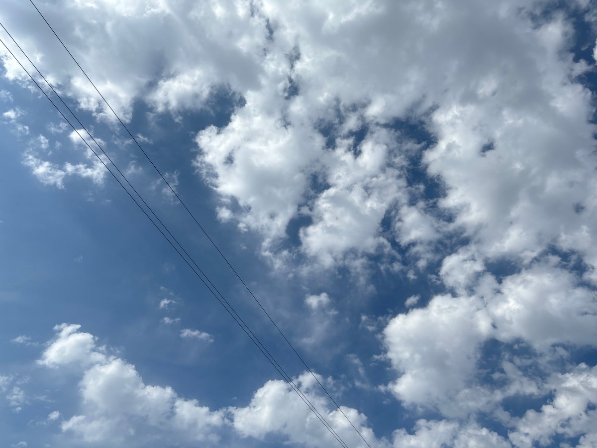 Looking up at Tashkent's skyline: TV tower, clouds, wires
