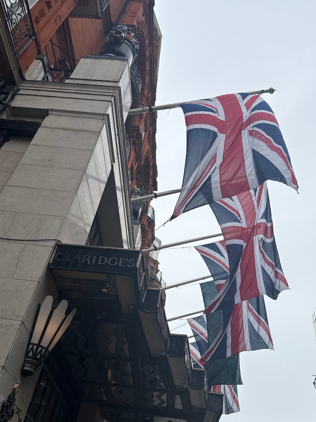 London morning scenes: hotel flags, craft displays, breakfast setting