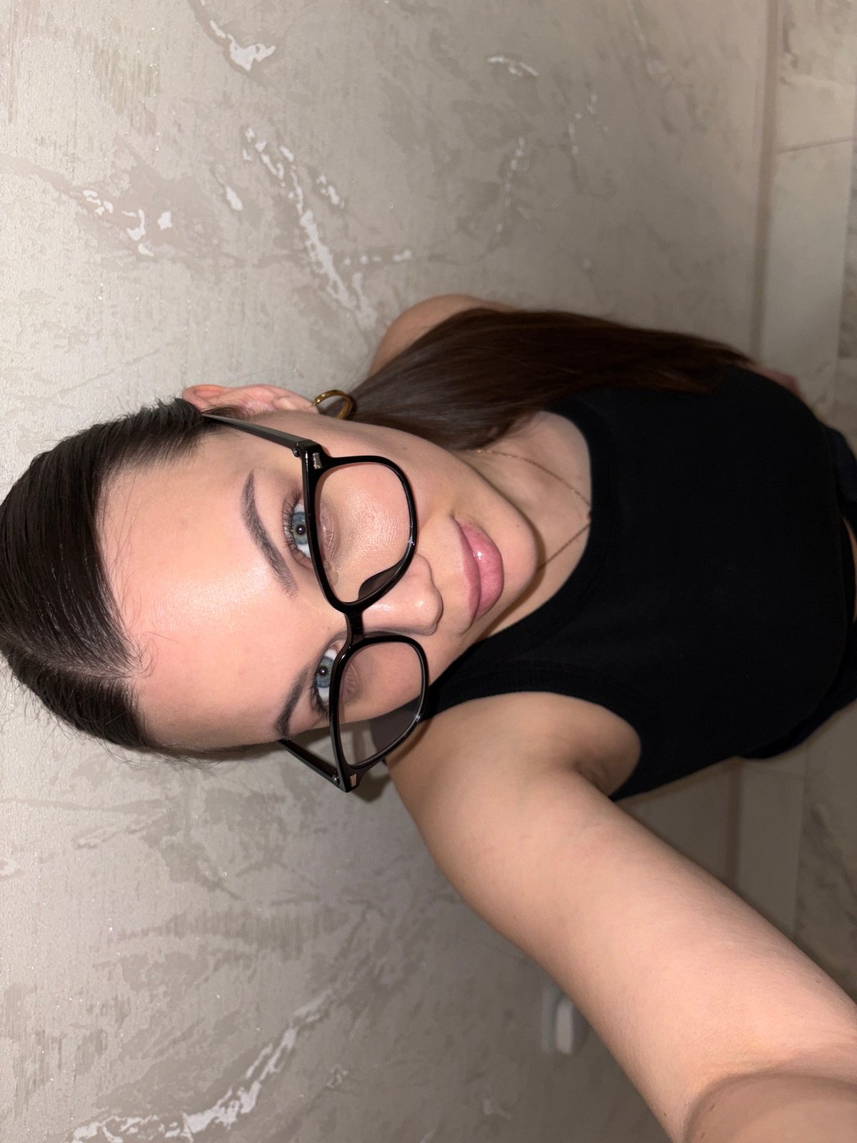 Woman takes selfies in mirror in Chaikovsky, Russia