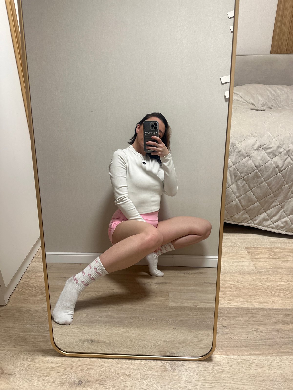 Woman takes mirror selfies in Votkinsk bedroom