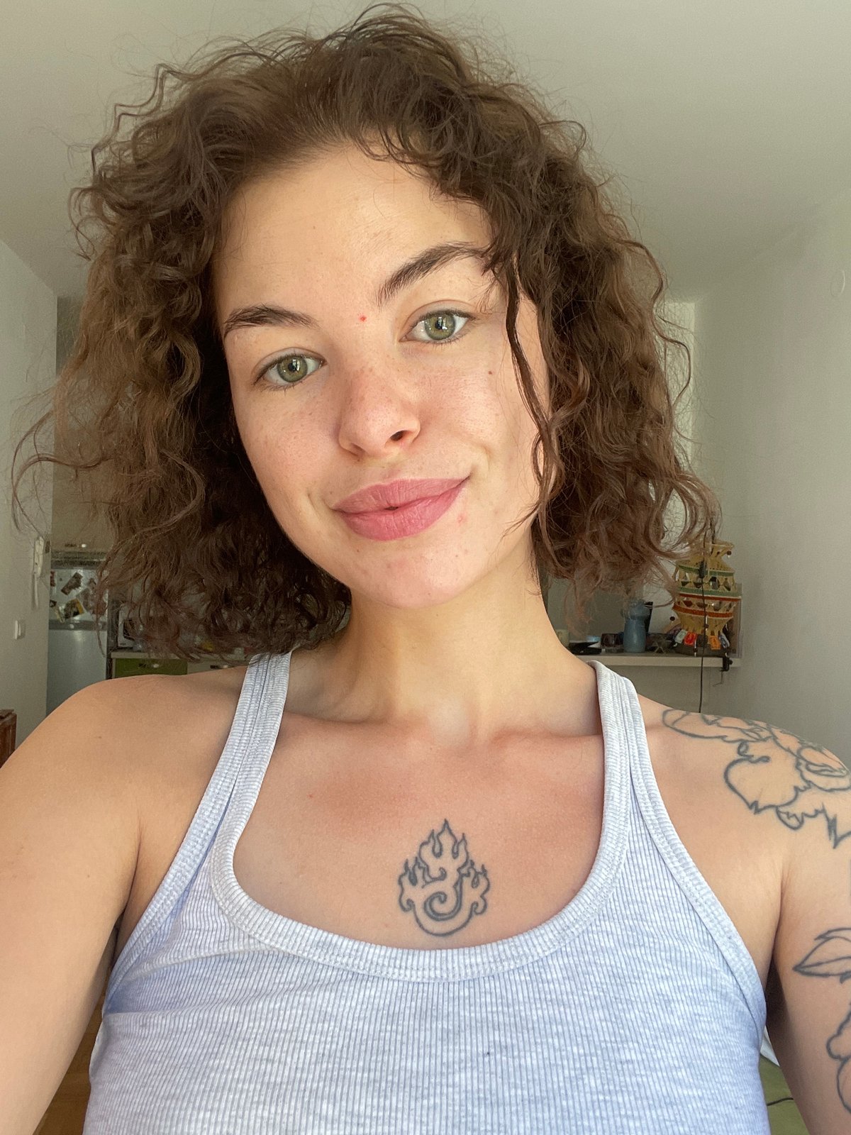 Back-to-back selfies in Boreti, Montenegro, same tattoos, different tops