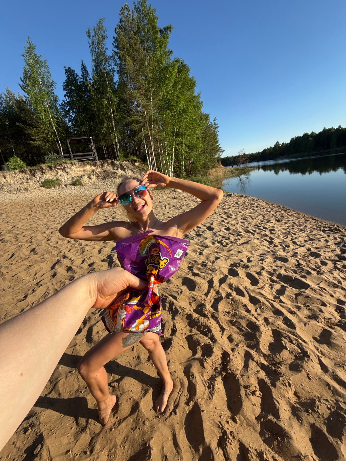 Family enjoys afternoon beach outing with dog at Russian lake