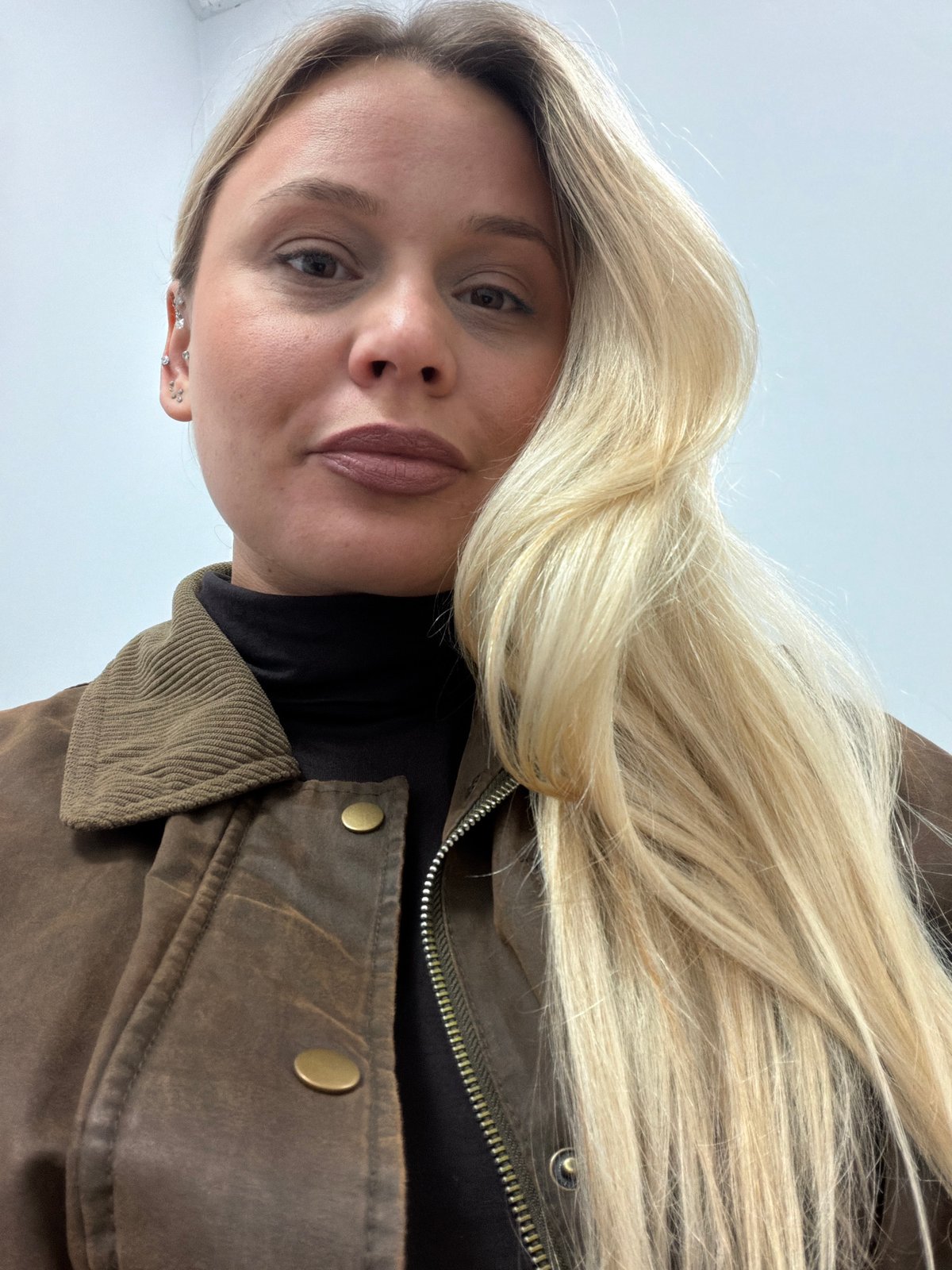 Woman documents selfie session across locations in Sarapul, Russia