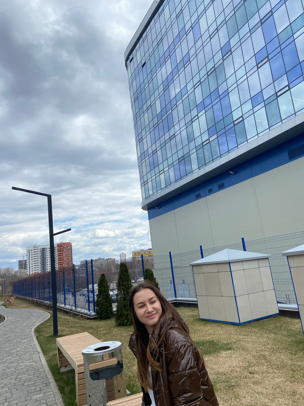 Woman poses with golden object in Izhevsk morning photo