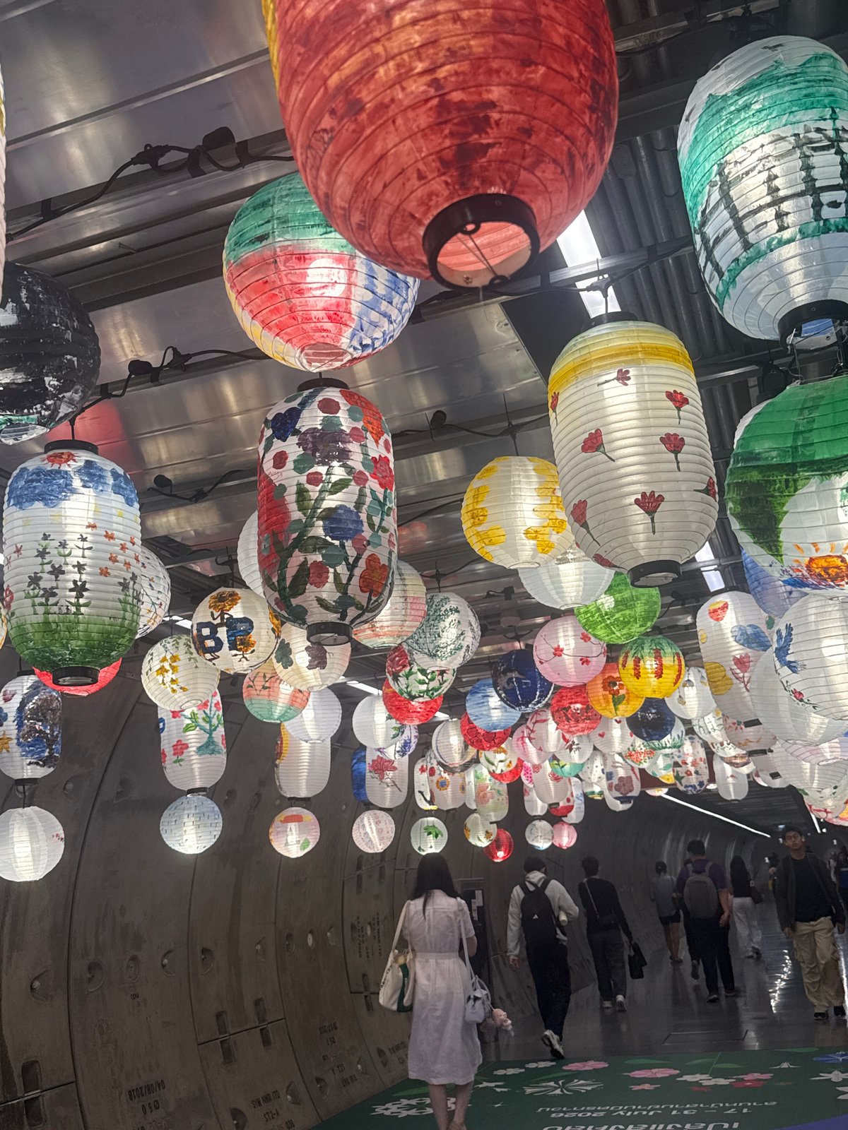Colorful lantern installation lines Bangkok streets near Mahanakhon