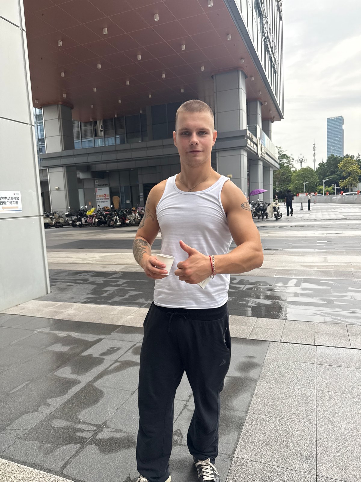Tourist documents morning walk through modern Huangpu District