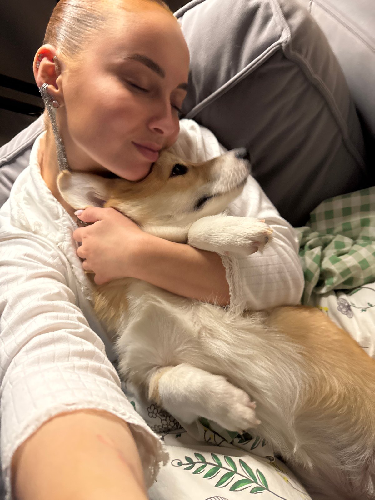 Woman and Corgi share quiet moment in Chaikovsky home