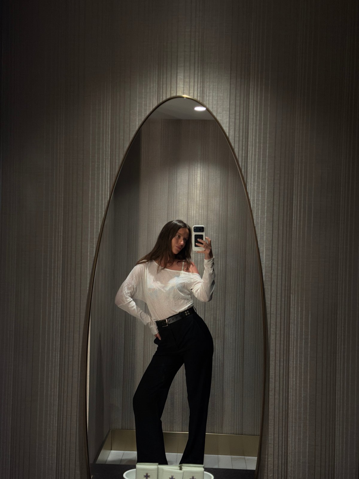 Woman takes mirror selfies in Budva Montenegro hotel
