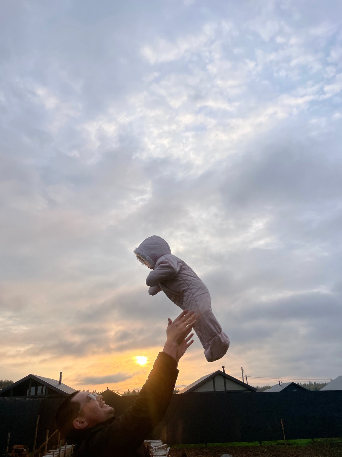 Person tosses baby snowsuit skyward in Russian village
