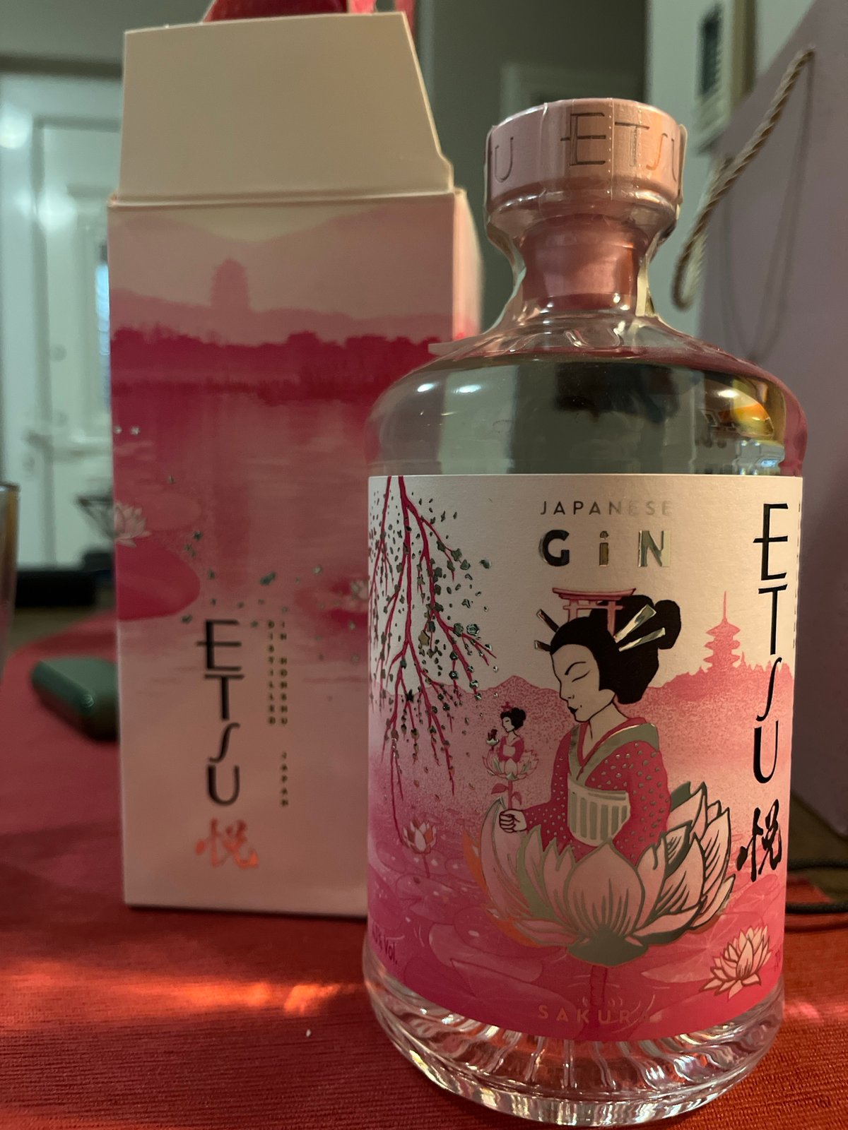 Japanese Gin Bottle Displayed on Red Tablecloth at Golden Beach