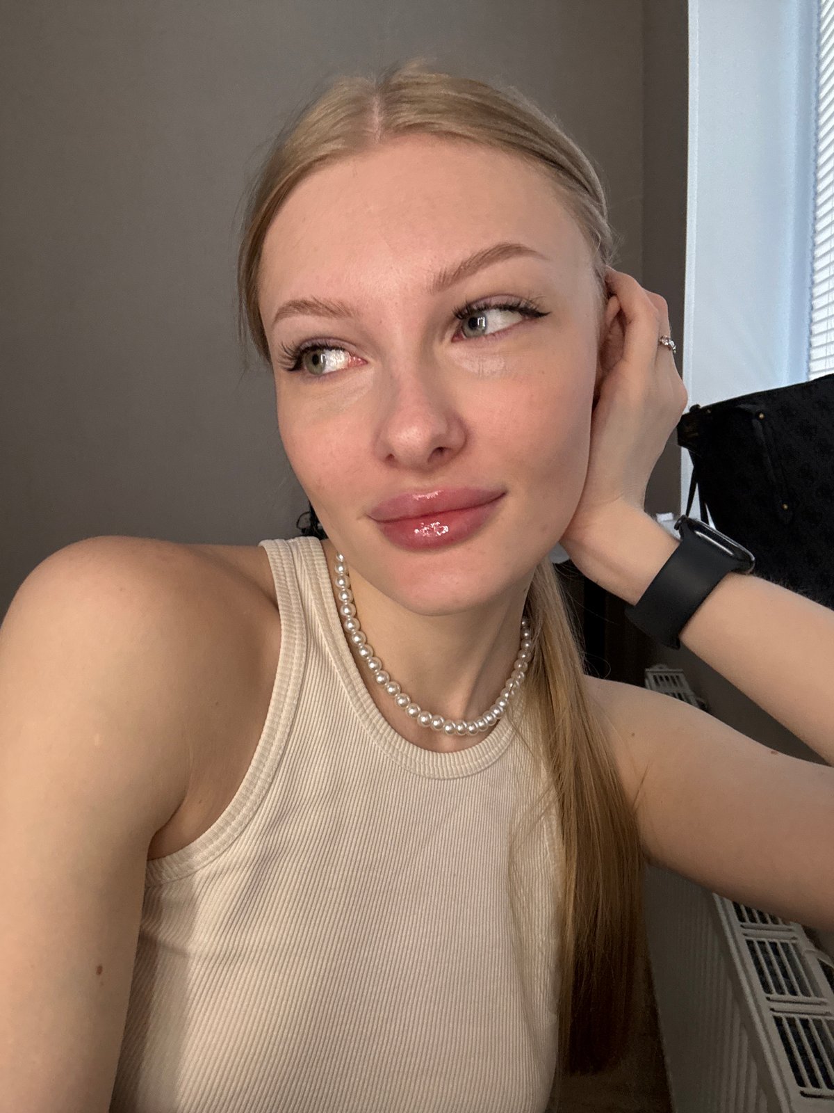Woman takes multiple selfies during brief photo session in Perm