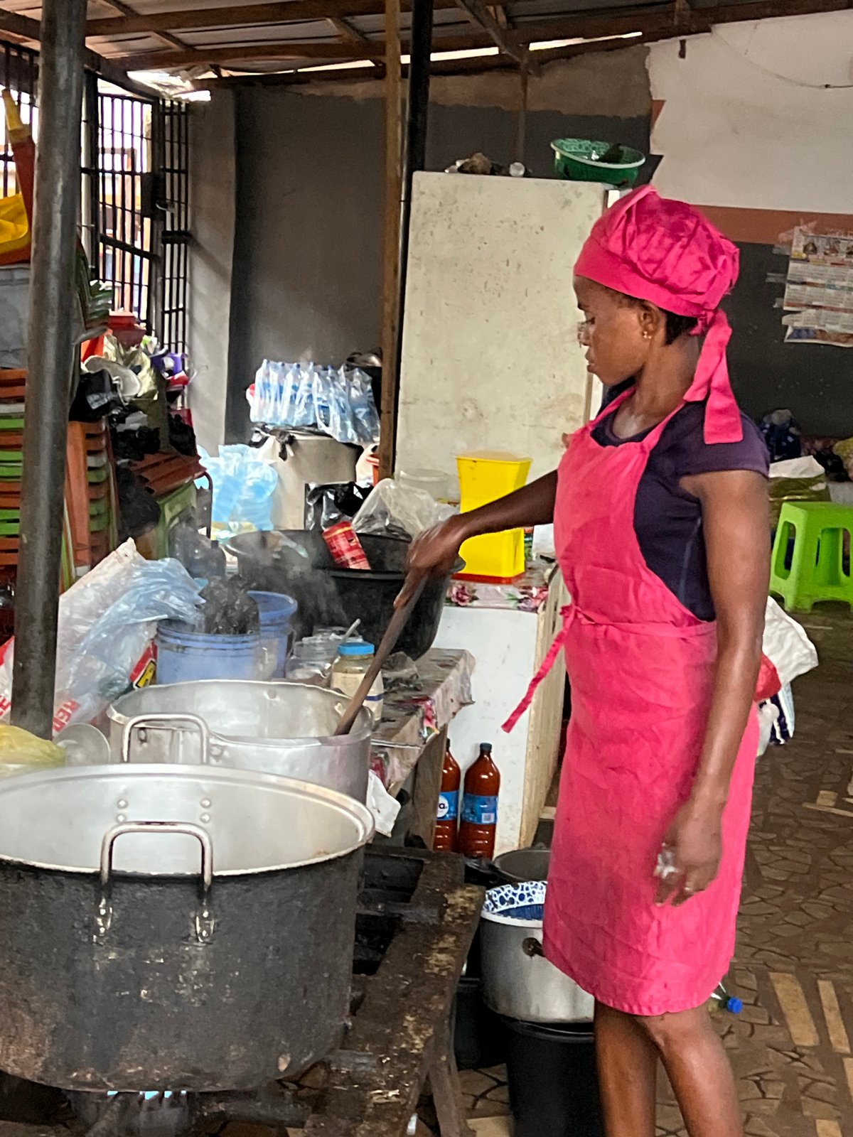 Communal outdoor cooking underway in Nkpor, Nigeria