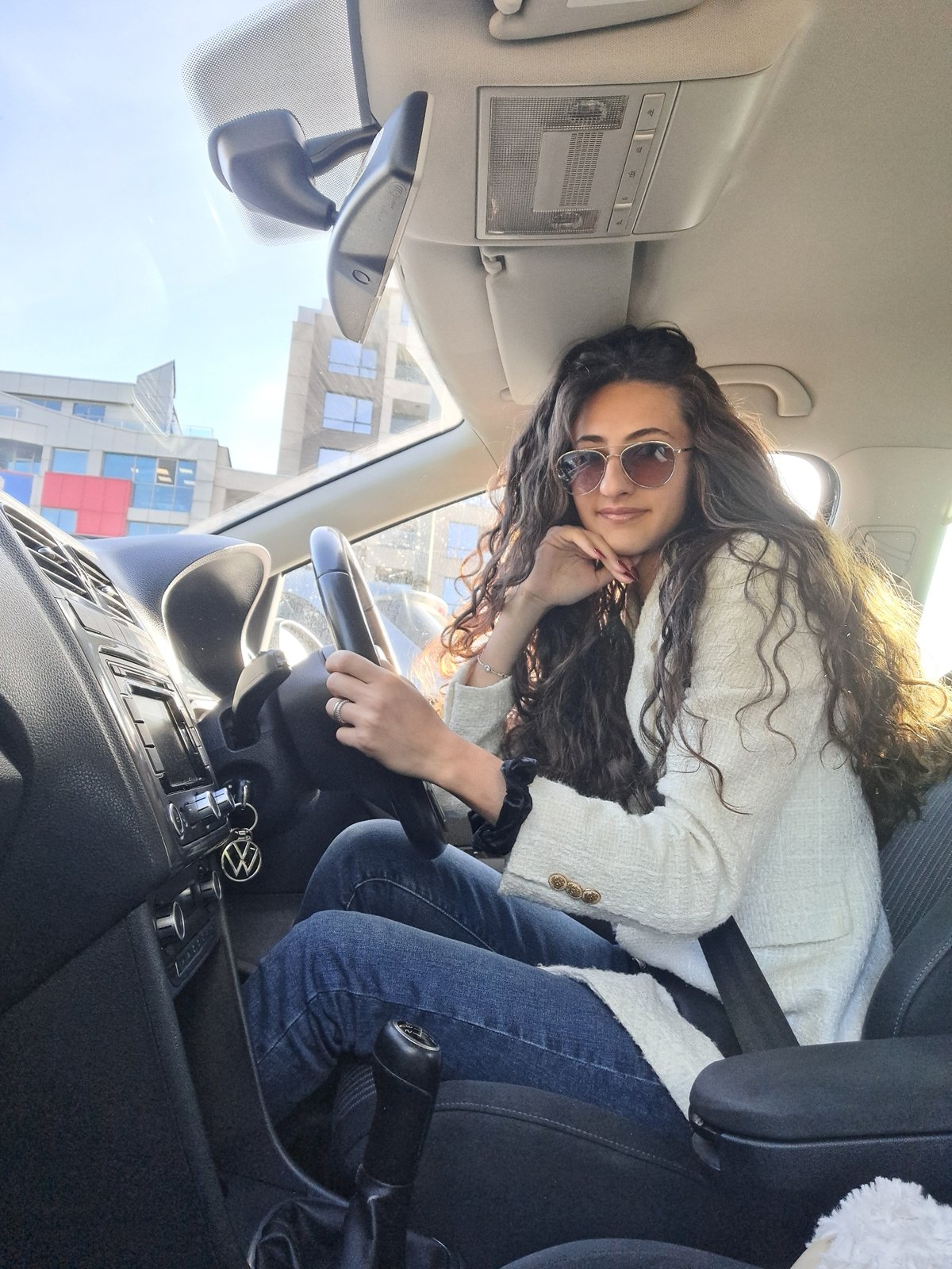 Woman in Volkswagen caught in Sofia morning traffic jam