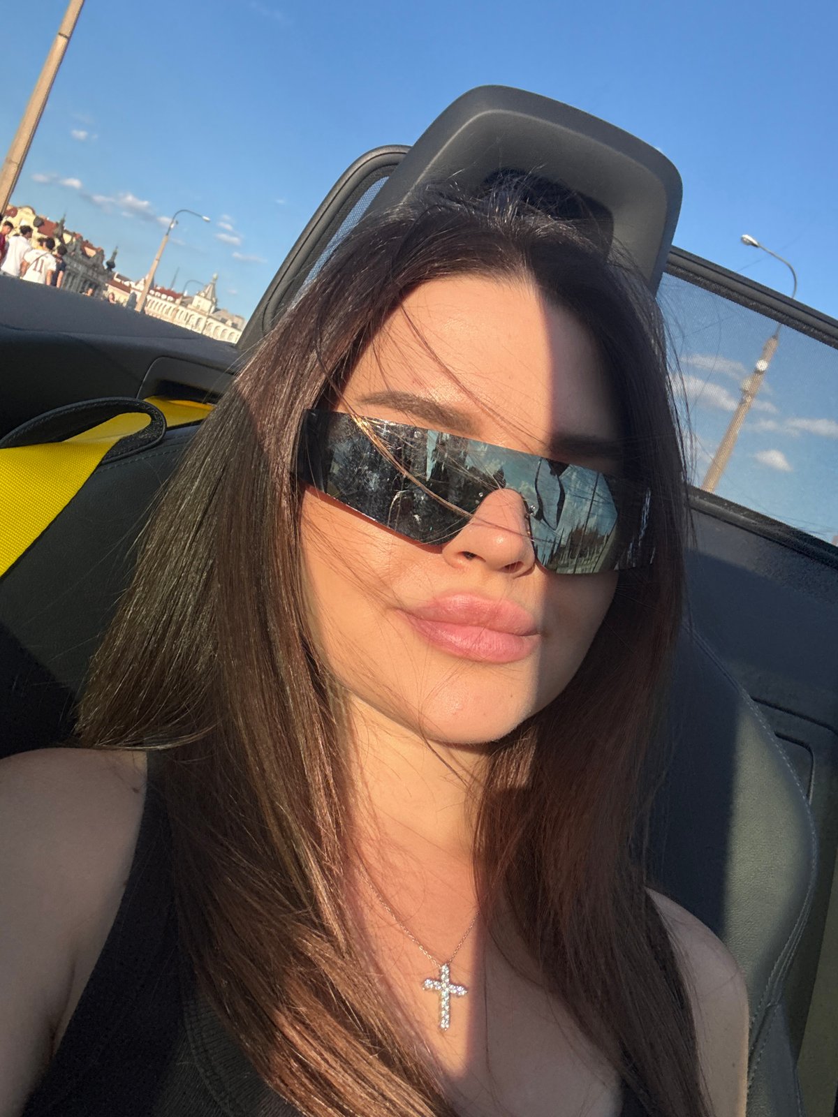Convertible selfie under blue skies in Prague