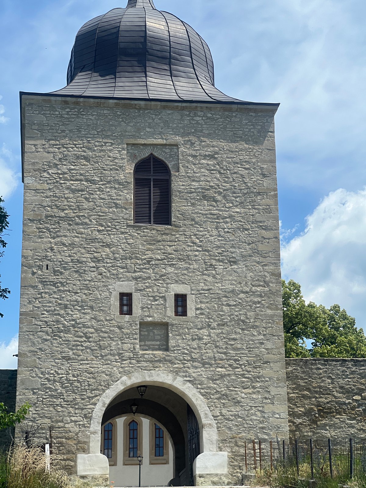 Morning walk around Bârnova's church, fences, and overgrown greenery