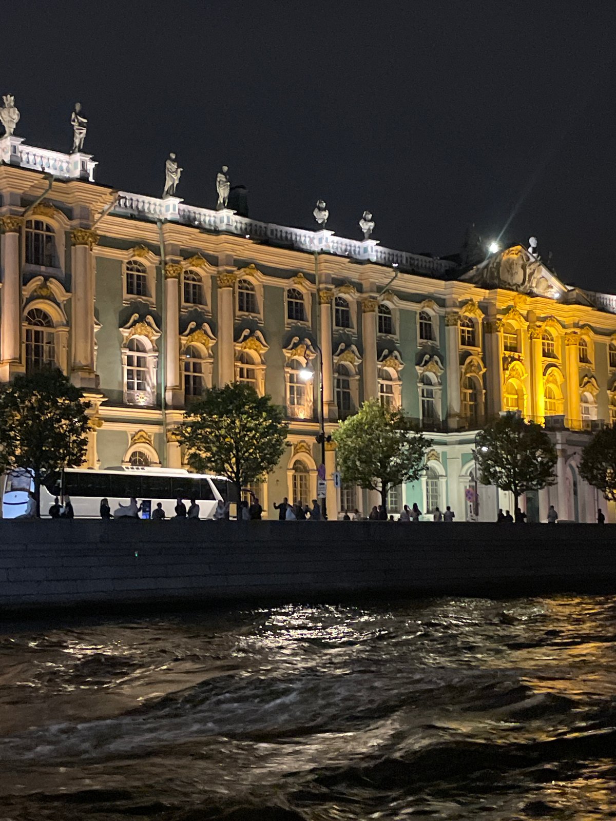 Palace Bridge raised at night, Winter Palace lit up beside it