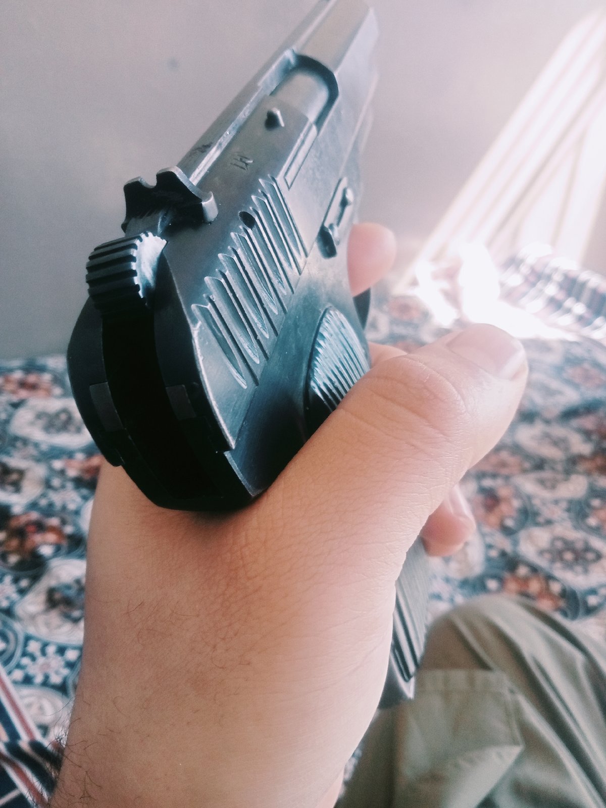 Firearm handling documented in multiple photographs in Mansehra