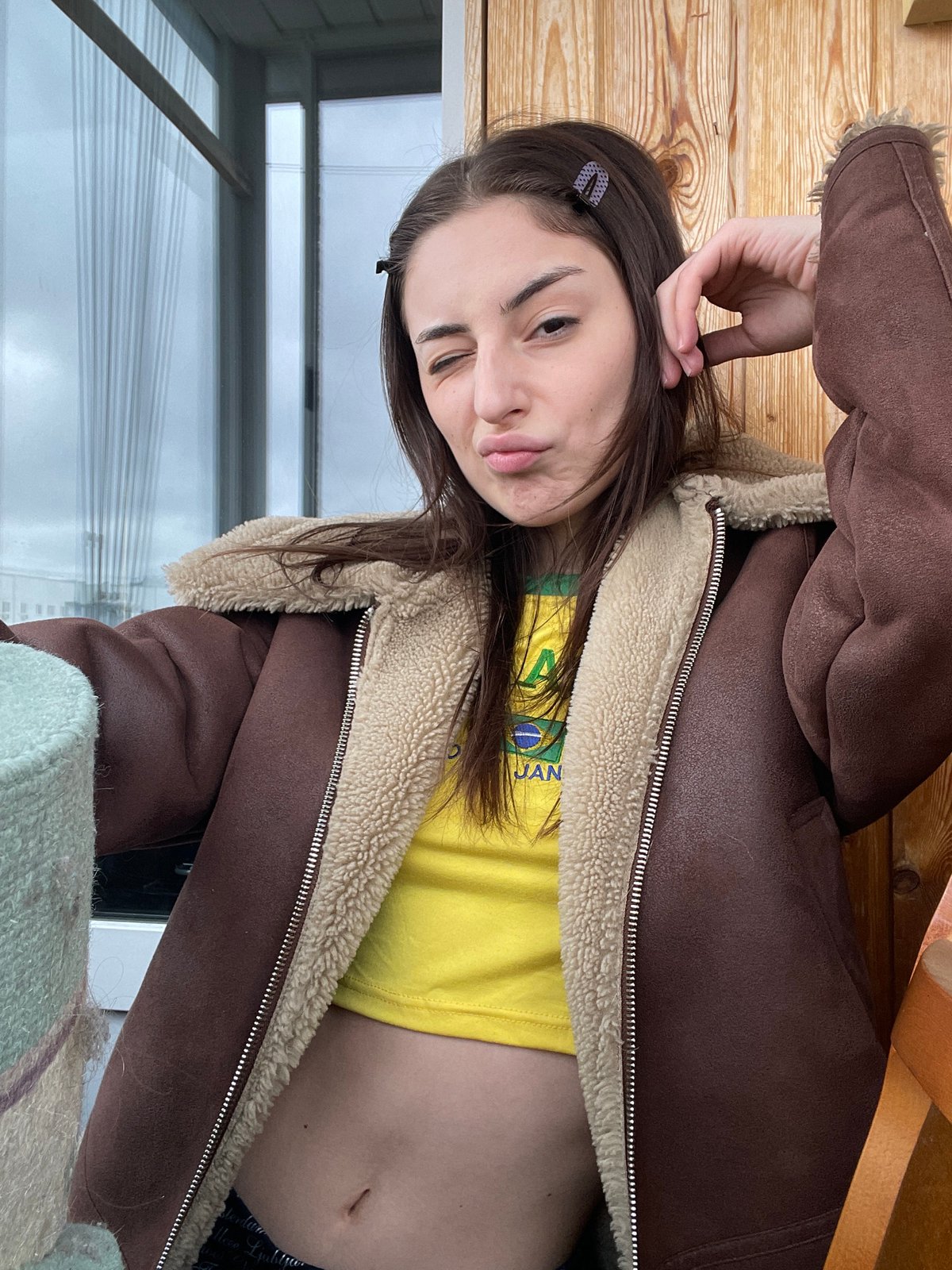 Woman poses playfully for photos in Moscow apartment