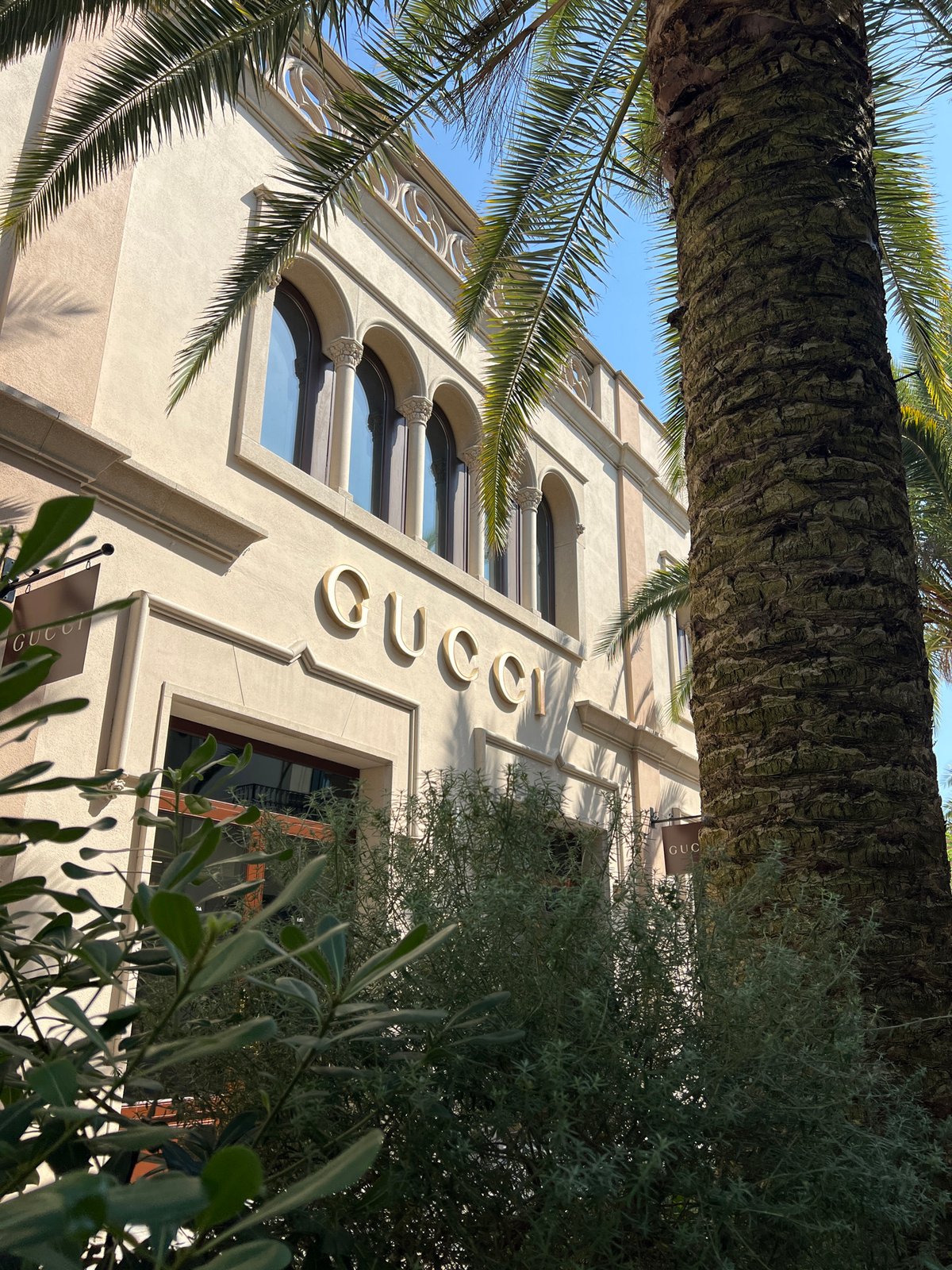 Man poses outside Gucci store in Spanish shopping district