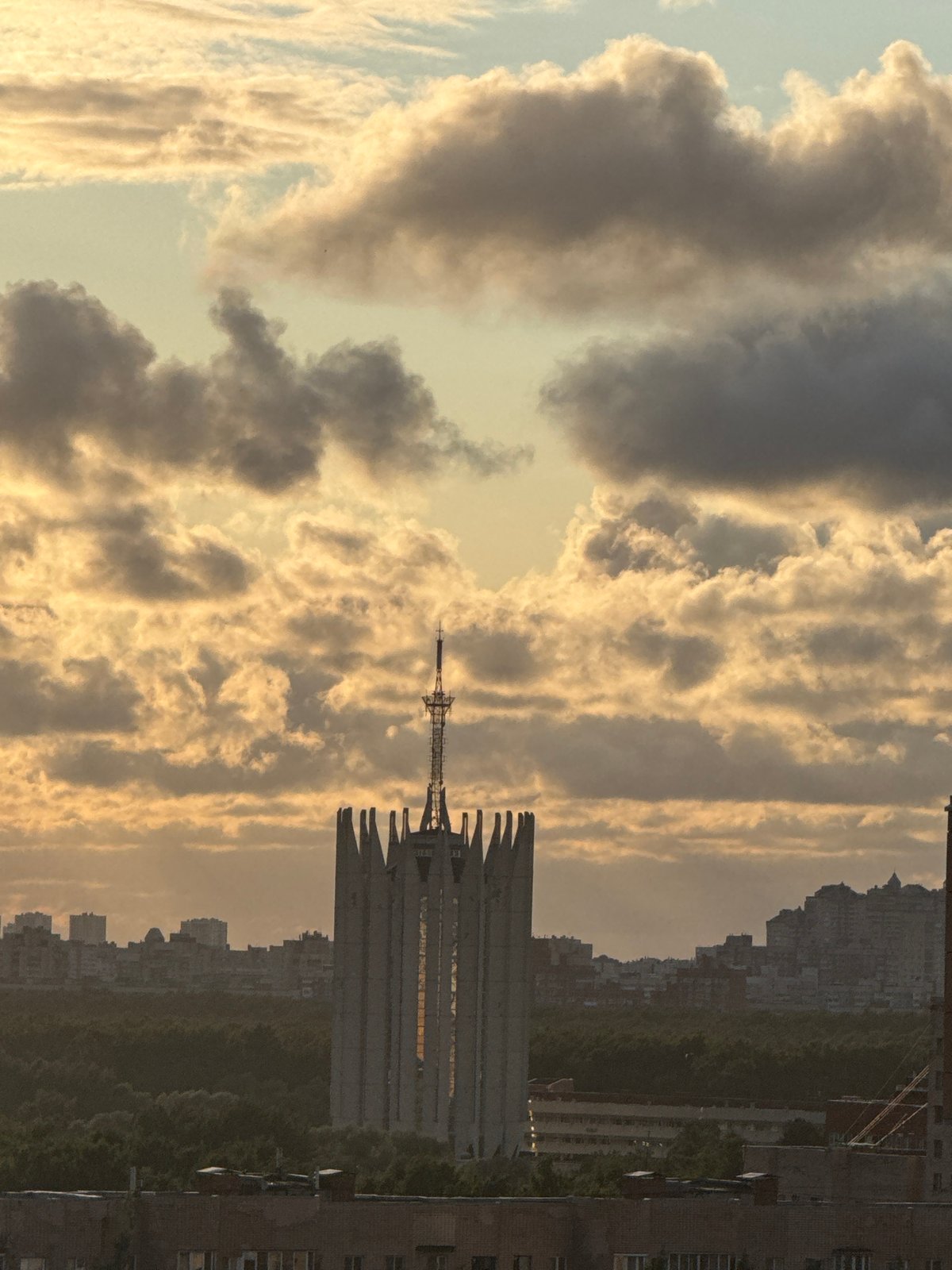 Dramatic sunset clouds over Sinyavino's residential skyline