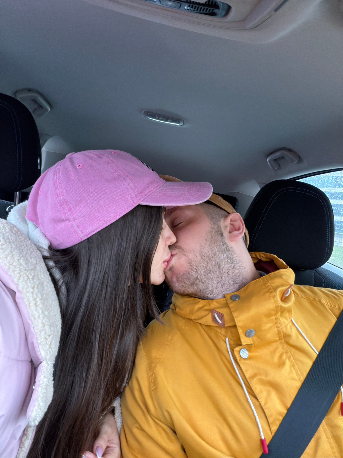 Couple shares intimate moment in car during Saint Petersburg morning