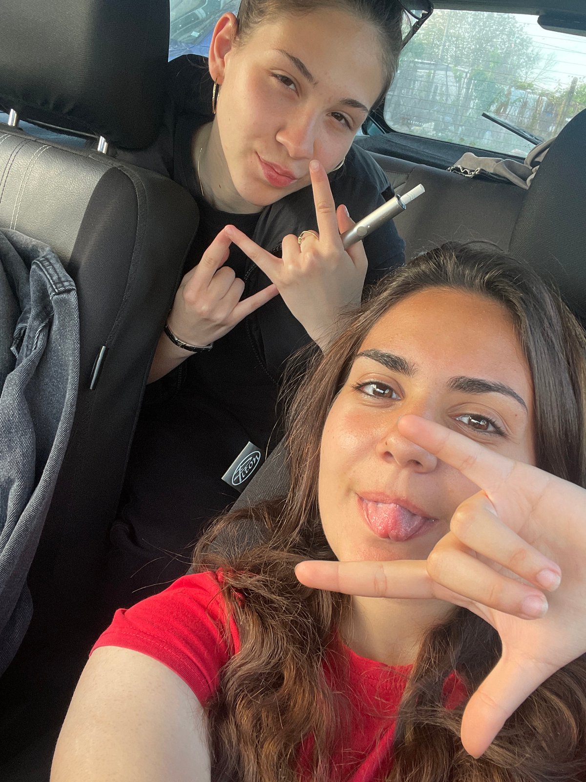 Two women take casual car selfies, multiple angles captured