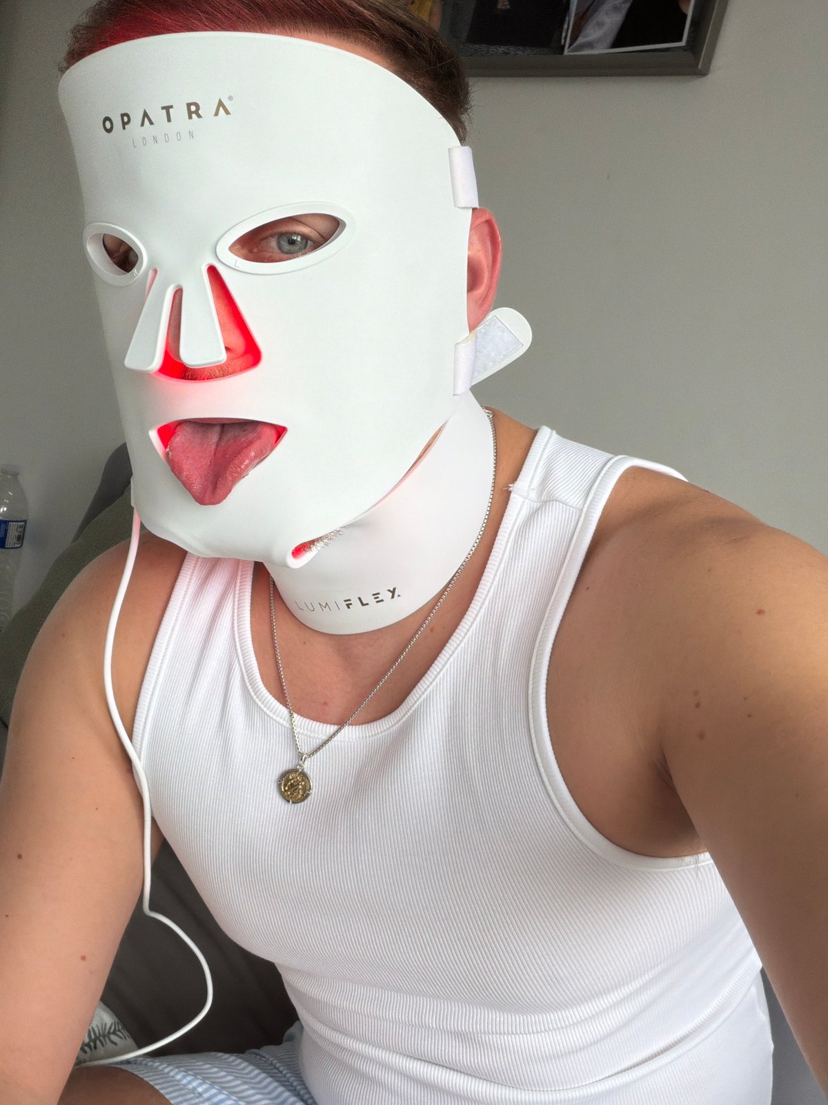 London resident uses LED light therapy mask in bed